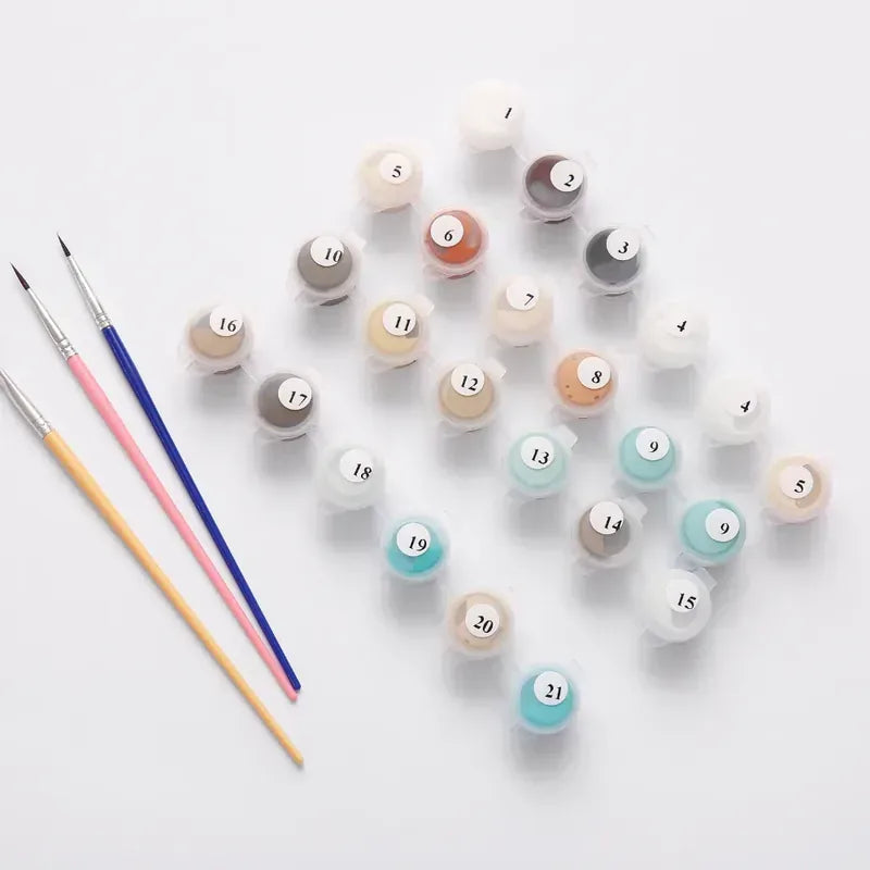 Numeromaalaussetin maalipurkit ja siveltimet valmiina aloittamiseen