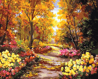 Thumbnail for Syksyinen metsäpolku kukkivien pensaiden ja värikkäiden lehtien ympäröimänä, lämmin valo siivilöityy kultaisten puiden läpi – paint by numbers -maalaus.